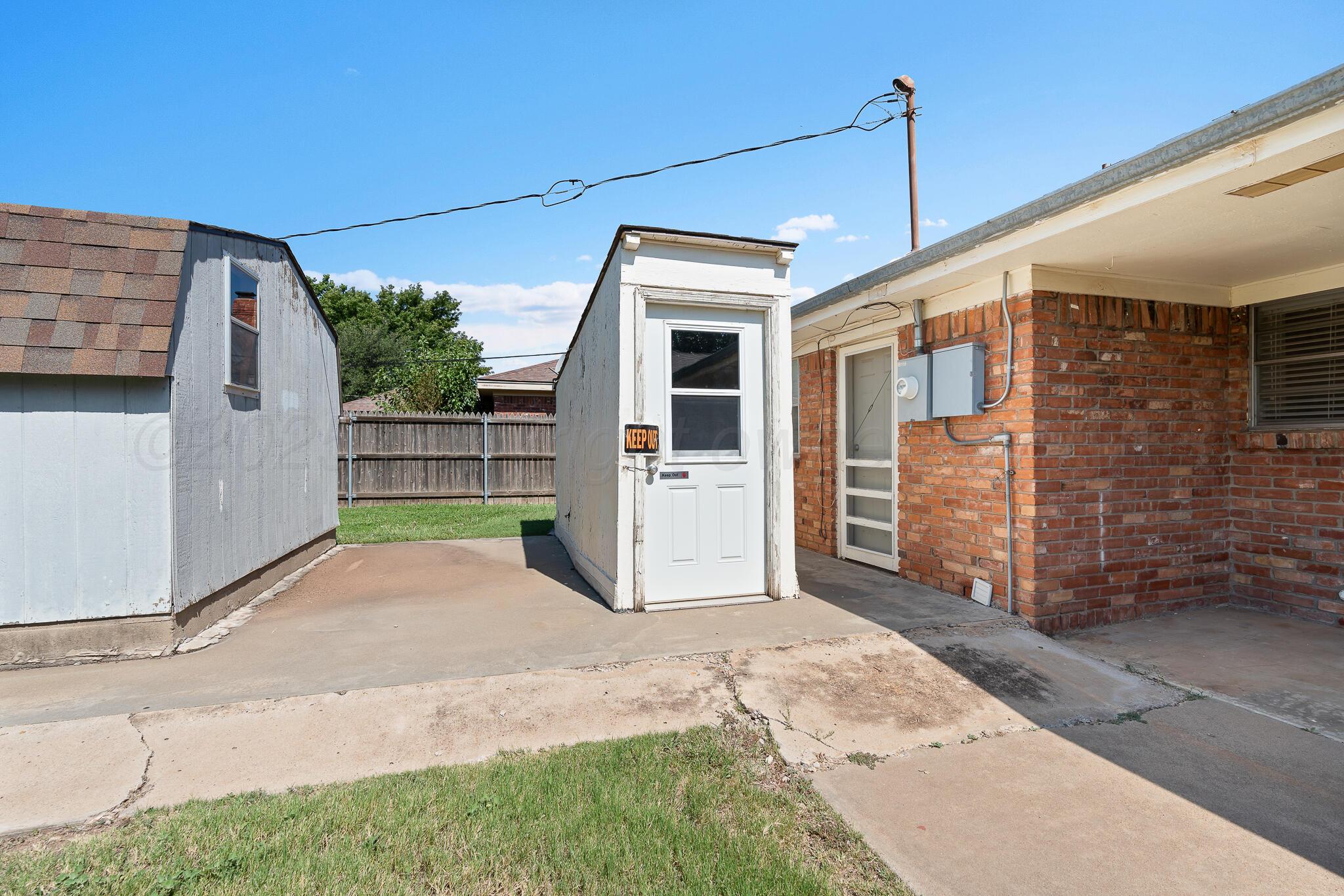 4803 Carole Lane Amarillo, TX 79110 - Photo 23 of 23 a view of a house with backyard and parking