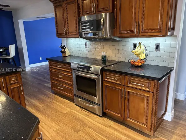 a view of a dining room with furniture and window
