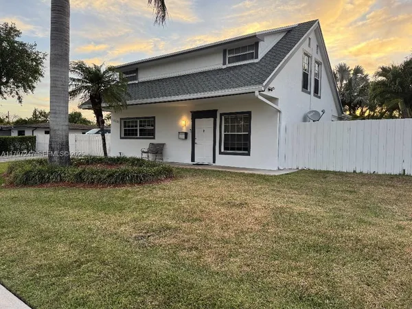 a house view with a garden space