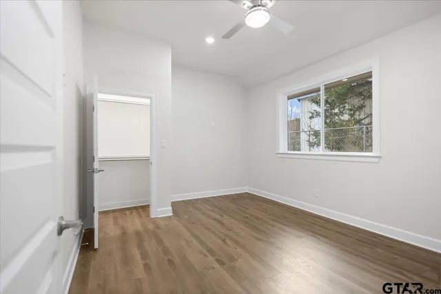 a bathroom with a sink toilet vanity and shower