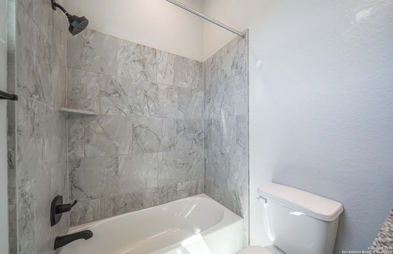 302 Venado Oaks Rio Medina, TX 78066 - Photo 16 of 34 a bath tub sitting next to a white toilet and a shower