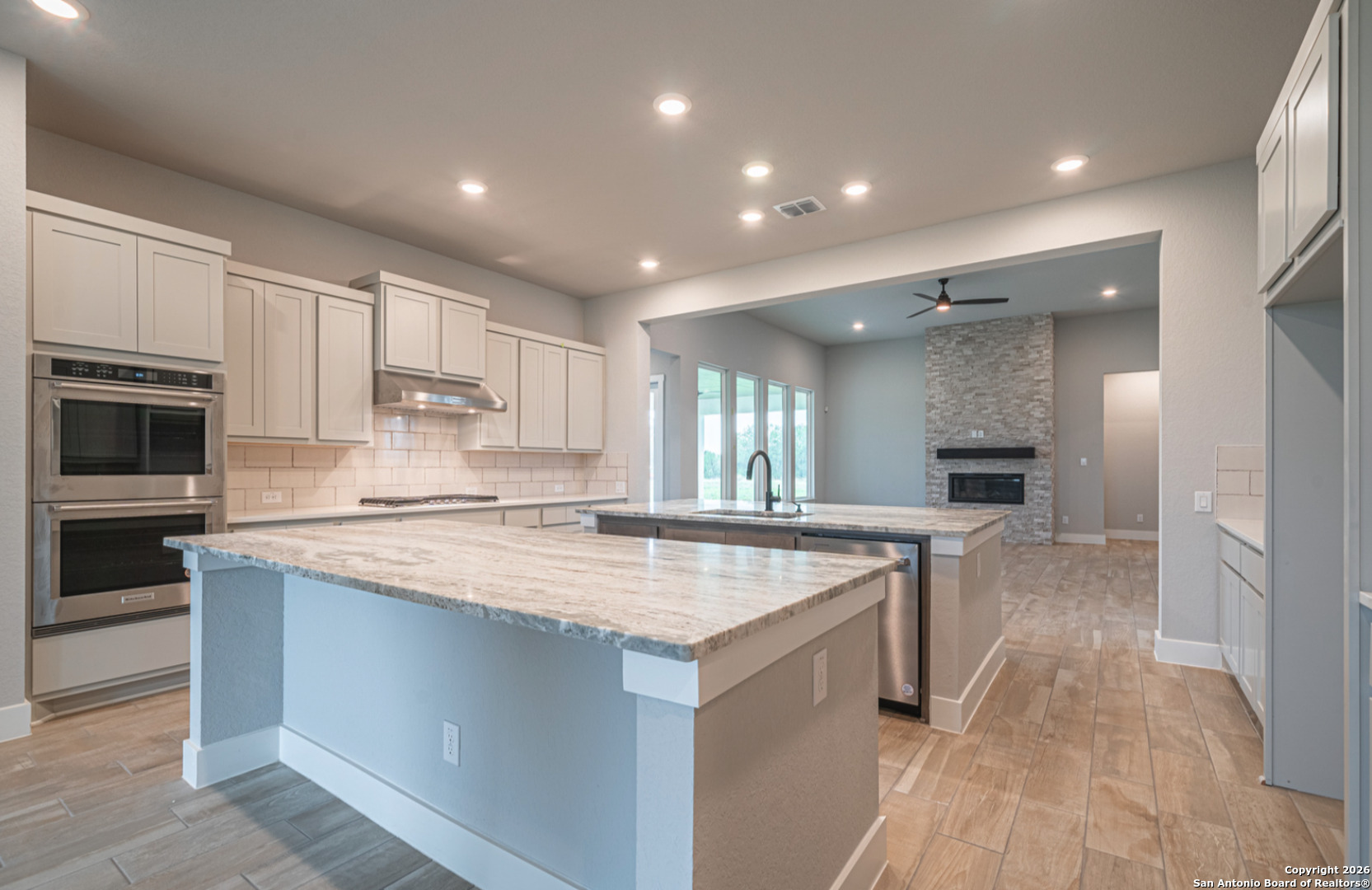 302 Venado Oaks Rio Medina, TX 78066 - Photo 6 of 34 a kitchen with a sink stove and microwave