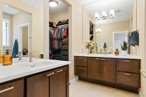 a bathroom with a sink double vanity and a mirror