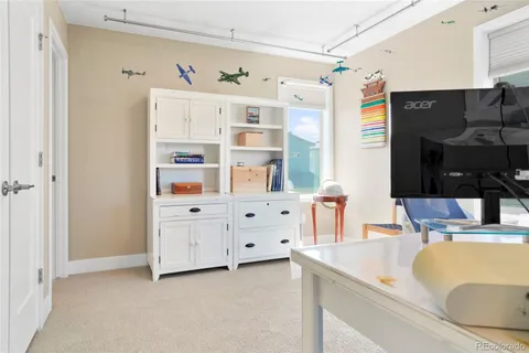 a kitchen with cabinets and window