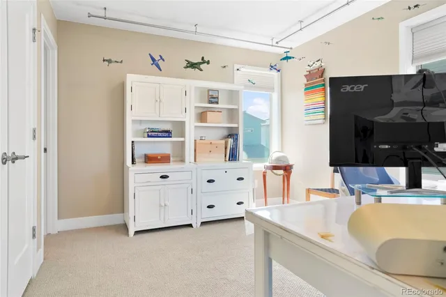 a kitchen with cabinets and window