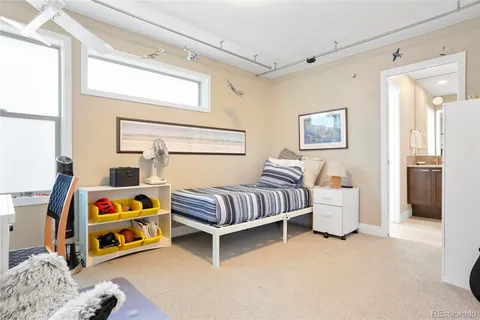 a bedroom with bed and a window