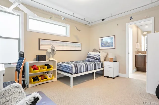 a bedroom with bed and a window