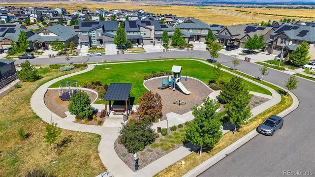 an aerial view of a house with a swimming pool yard and lake view