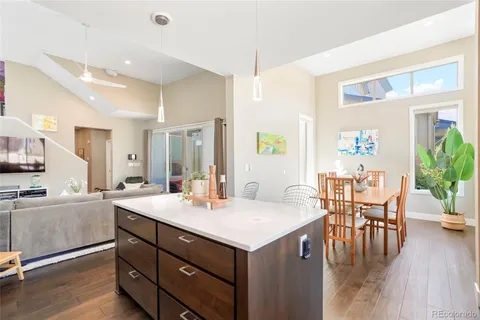 a view of living room with granite countertop furniture and wooden floor