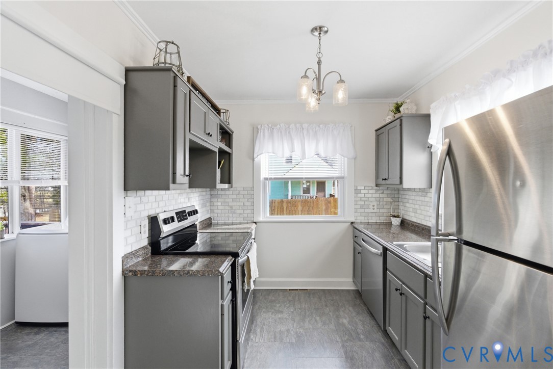 61 Mohawk Road Buckingham, VA 23921 - Photo 20 of 40 a kitchen with stainless steel appliances granite countertop a refrigerator a stove a sink and a microwave