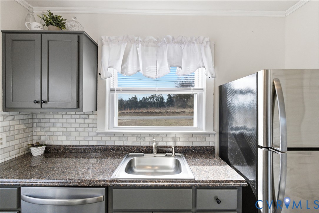 61 Mohawk Road Buckingham, VA 23921 - Photo 21 of 40 a kitchen with granite countertop a sink stainless steel appliances and cabinets