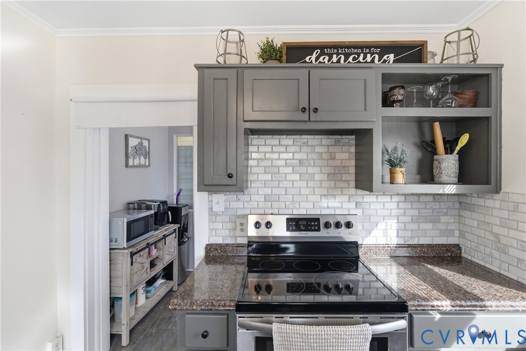 61 Mohawk Road Buckingham, VA 23921 - Photo 22 of 40 a kitchen with stainless steel appliances granite countertop a stove and cabinets