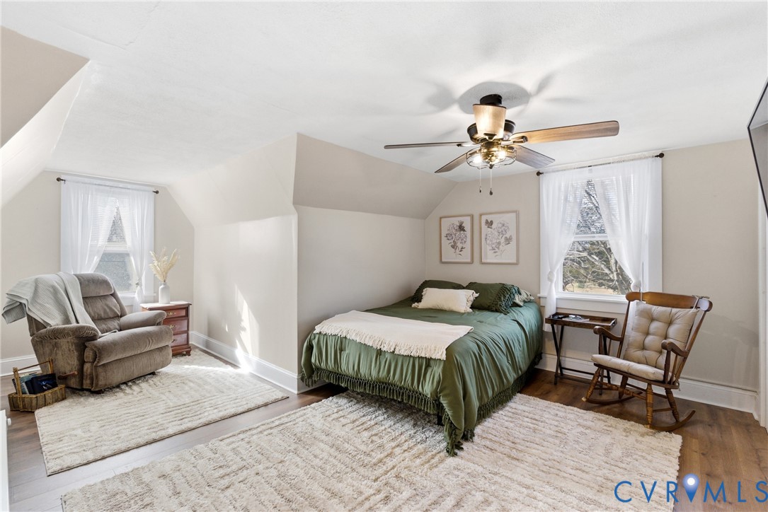 61 Mohawk Road Buckingham, VA 23921 - Photo 24 of 40 a bedroom with a bed a chandelier and a couch