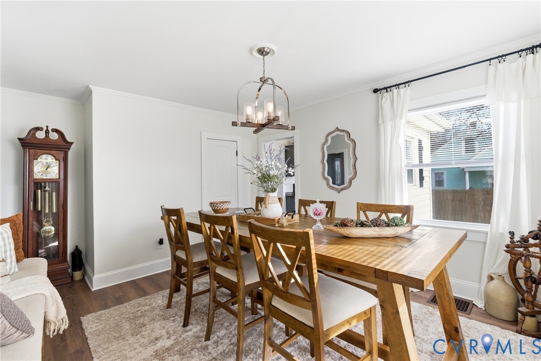 61 Mohawk Road Buckingham, VA 23921 - Photo 10 of 40 a view of a dining room with furniture a chandelier and wooden floor