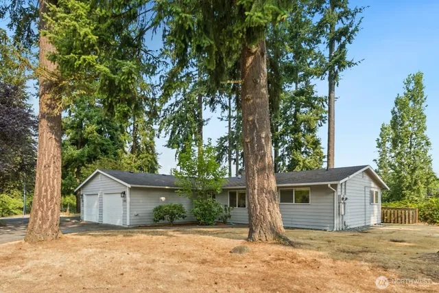 front view of a house with a tree