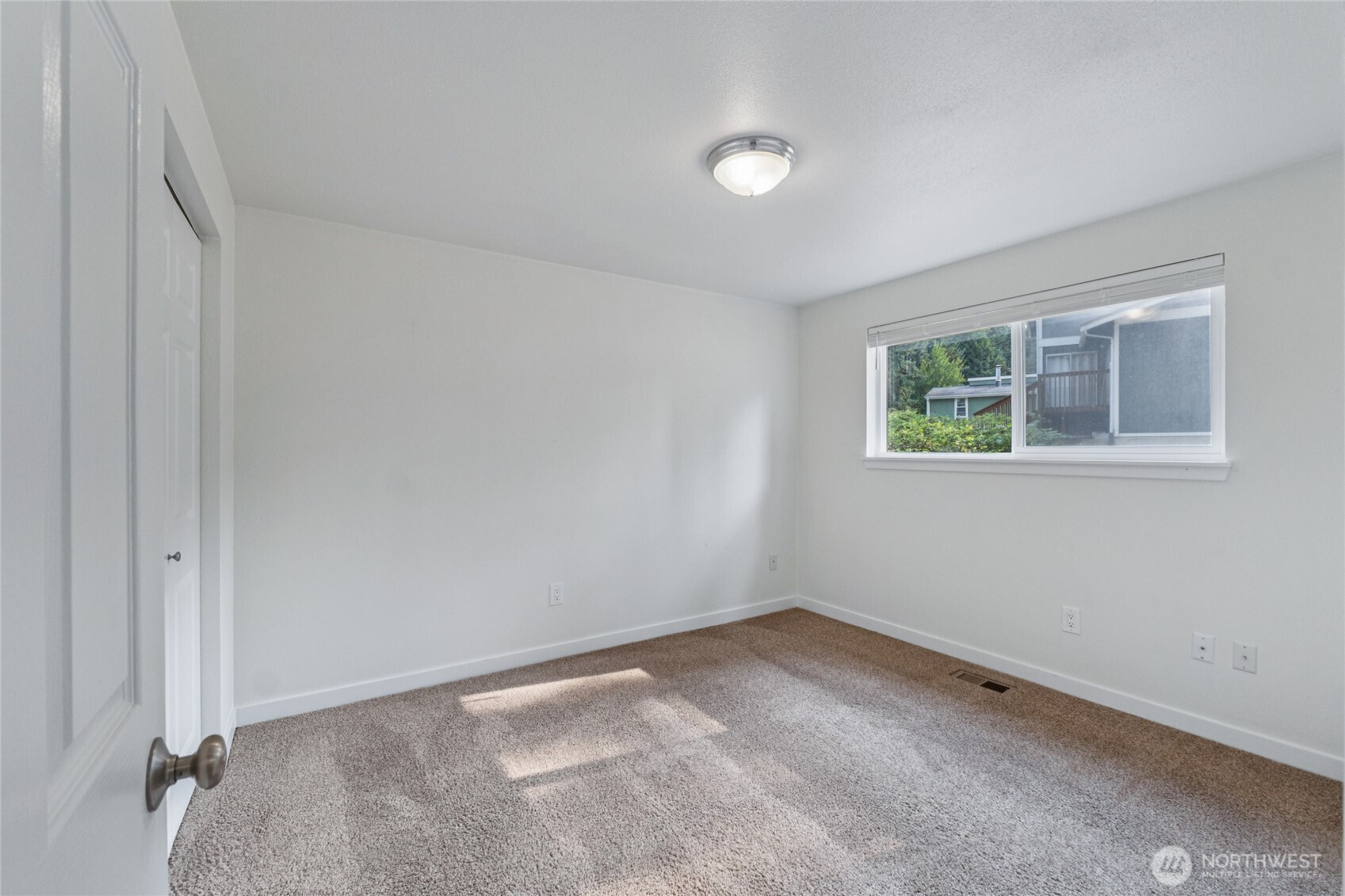 2405 B Street Steilacoom, WA 98388 - Photo 16 of 27 an empty room with a window