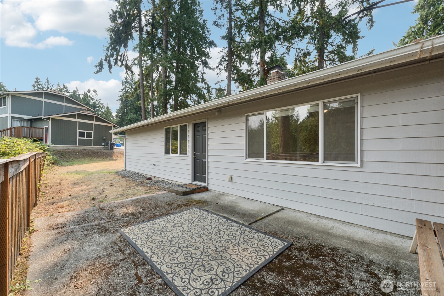 2405 B Street Steilacoom, WA 98388 - Photo 21 of 27 a view of a backyard with a large tree