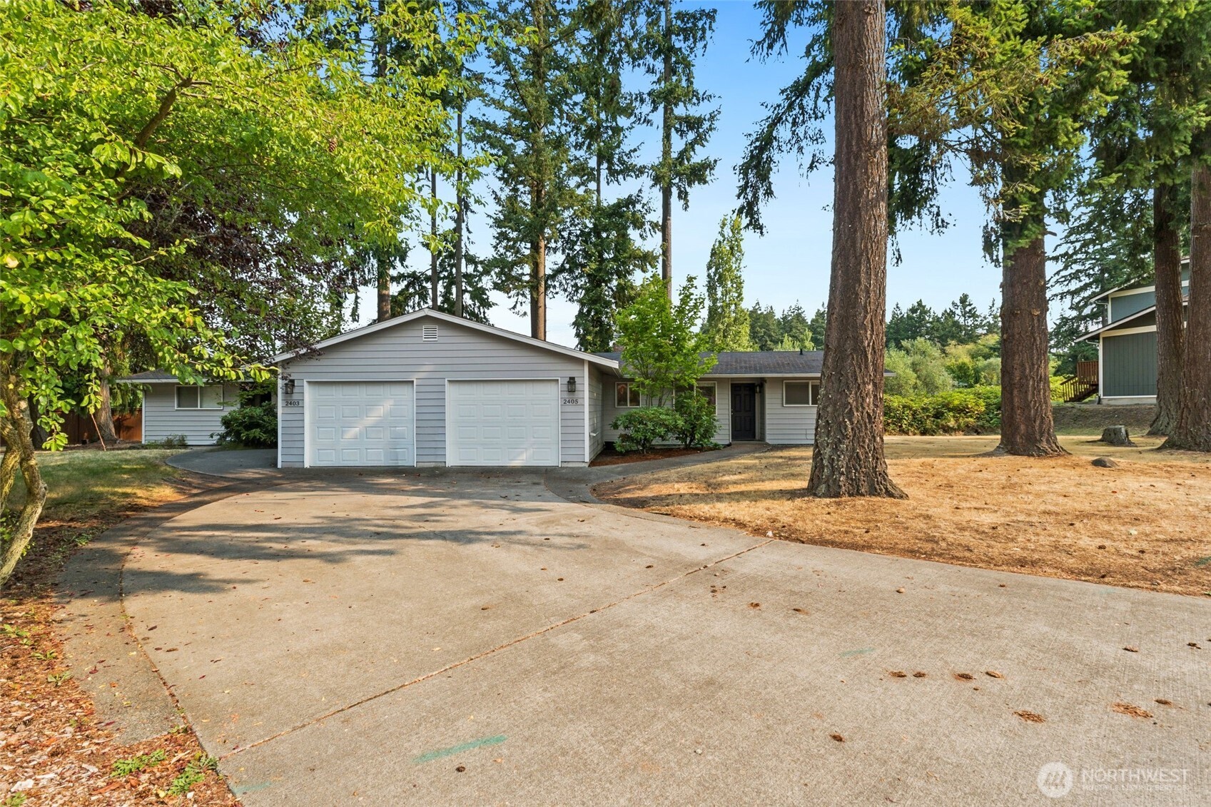 2405 B Street Steilacoom, WA 98388 - Photo 25 of 27 a house with trees in front of it