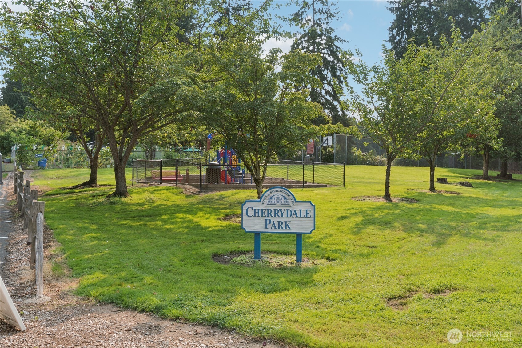 2405 B Street Steilacoom, WA 98388 - Photo 26 of 27 a view of a park with trees and wooden fence