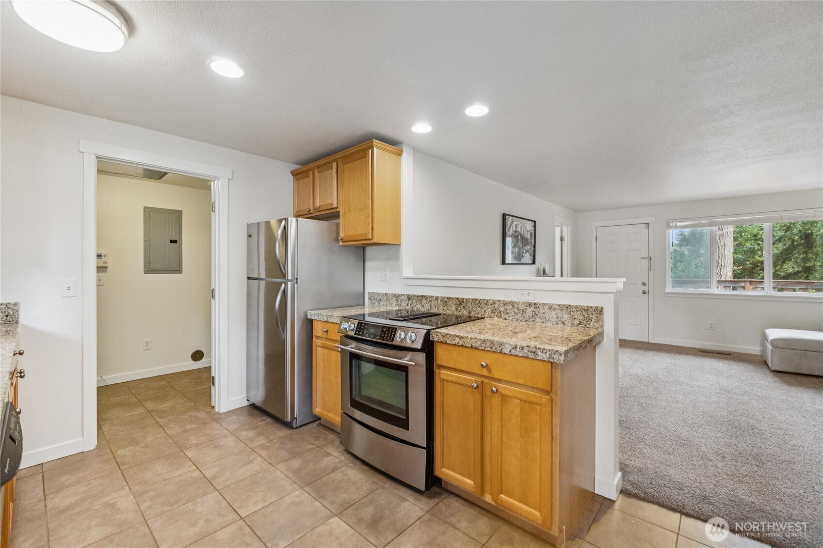 2405 B Street Steilacoom, WA 98388 - Photo 10 of 27 a kitchen with a stove top oven and refrigerator