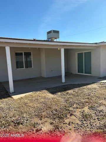 a view of a house with a snow in the yard