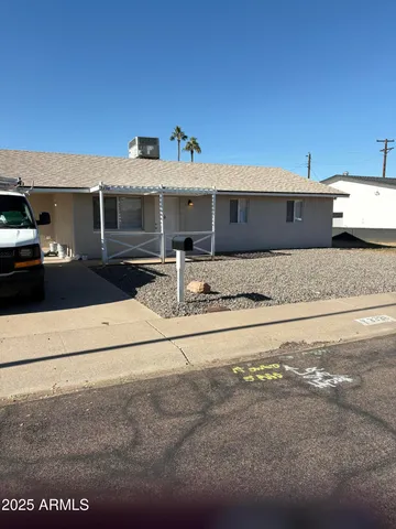 a front view of a house with yard