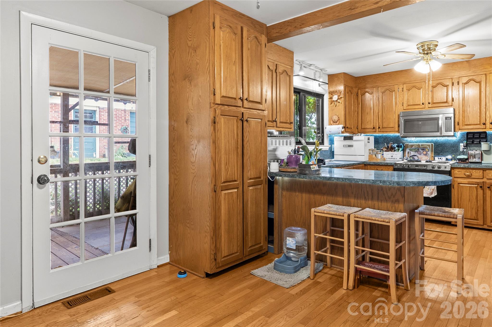 325 Swanson Road Lenoir, NC 28645 - Photo 15 of 35 a dining room with wooden floor and stainless steel appliances