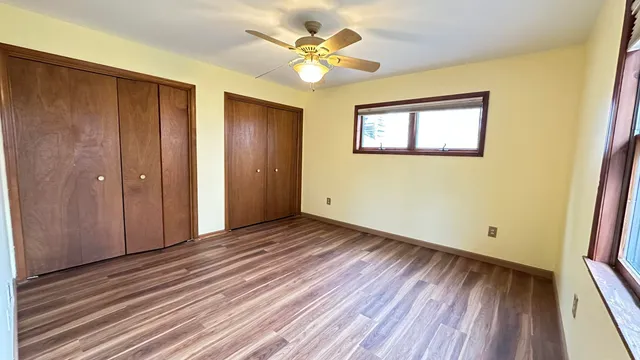 a view of a livingroom with a chandelier fan