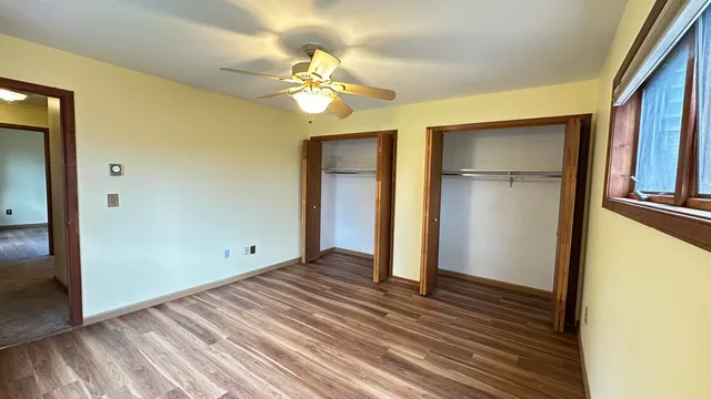 a view of a livingroom with wooden floor