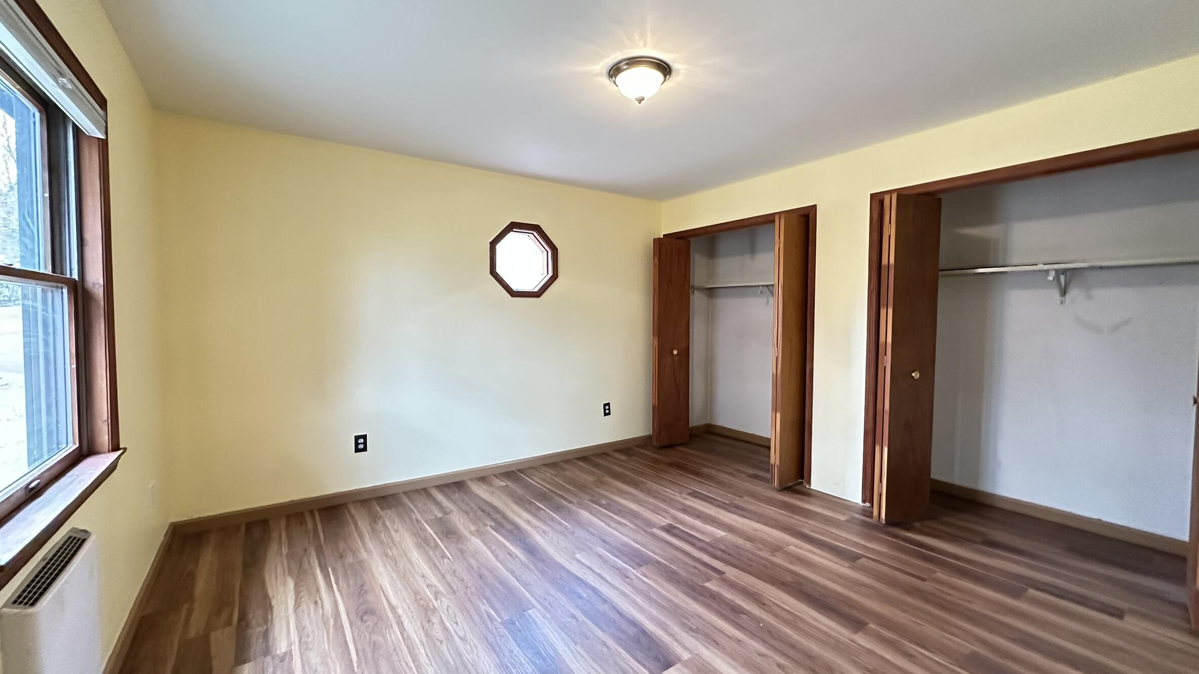 227 Image Drive Scotrun, PA 18355 - Photo 32 of 39 an empty room with wooden floor and windows