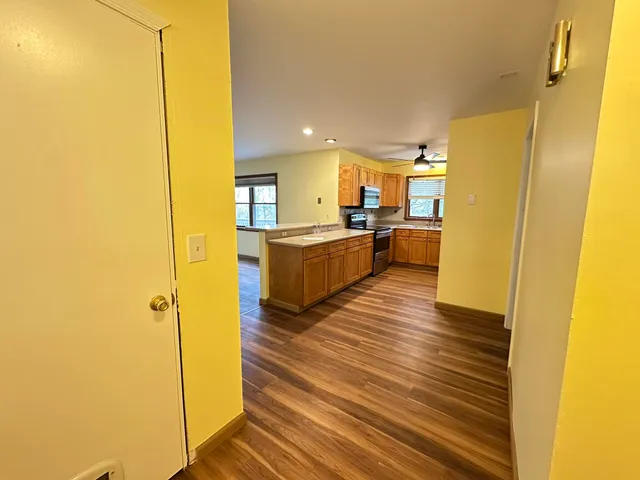 a view of a kitchen from the hallway