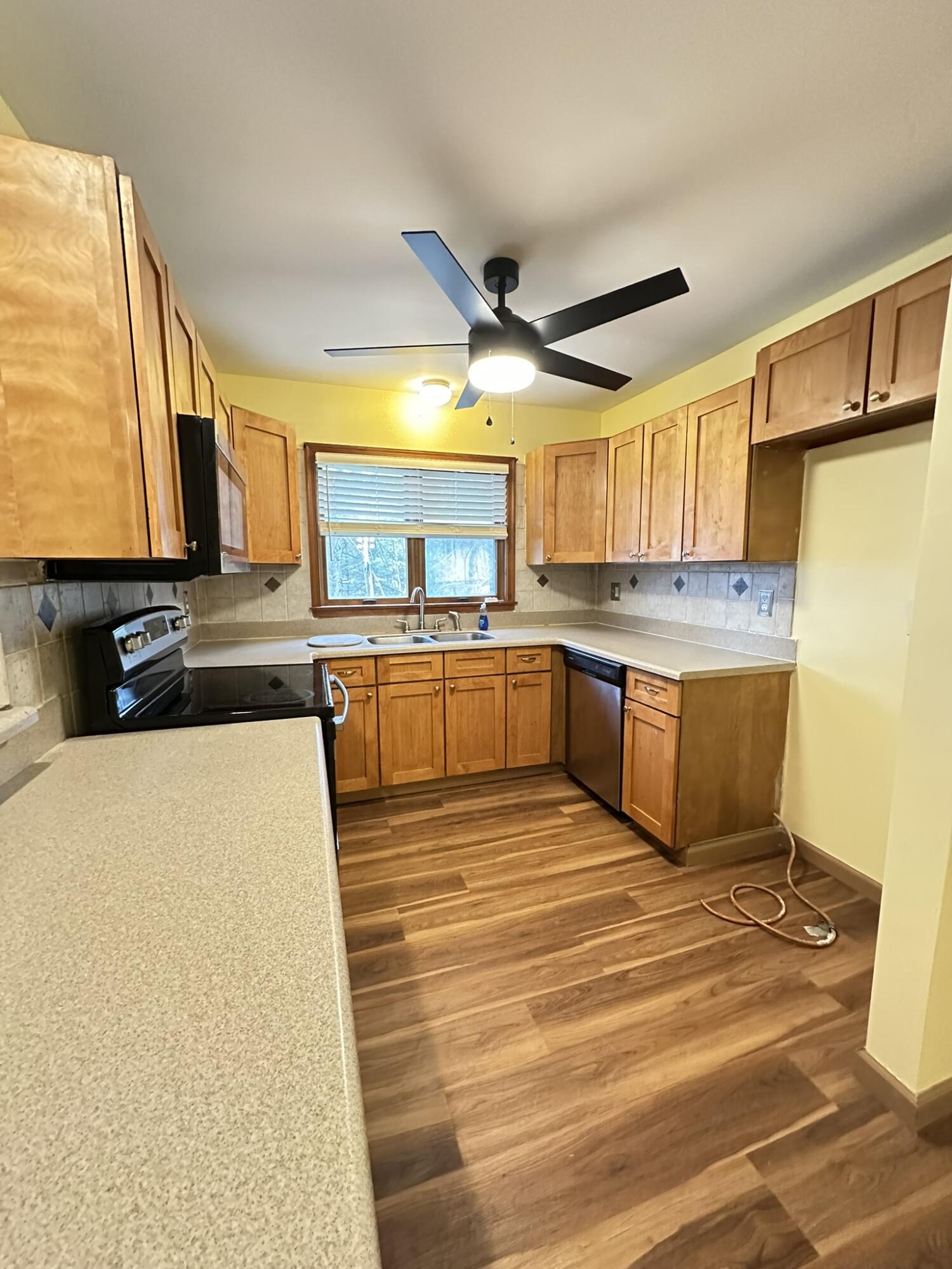 227 Image Drive Scotrun, PA 18355 - Photo 7 of 39 a kitchen with stainless steel appliances granite countertop a sink counter space cabinets and a large window