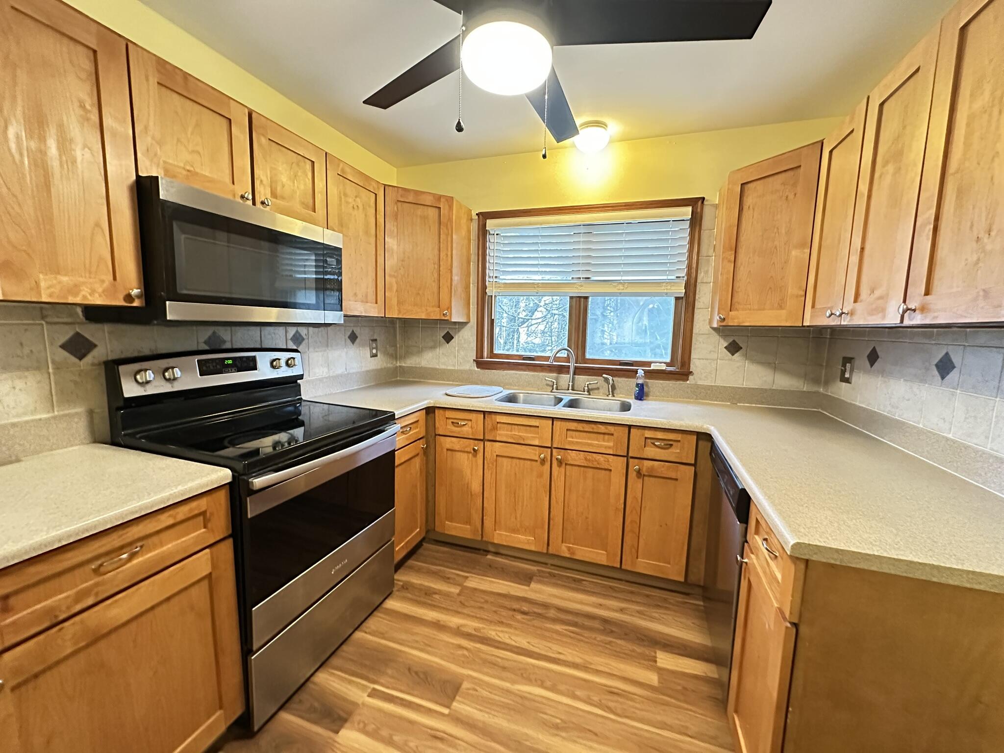 227 Image Drive Scotrun, PA 18355 - Photo 8 of 39 a kitchen with stainless steel appliances a stove sink and microwave