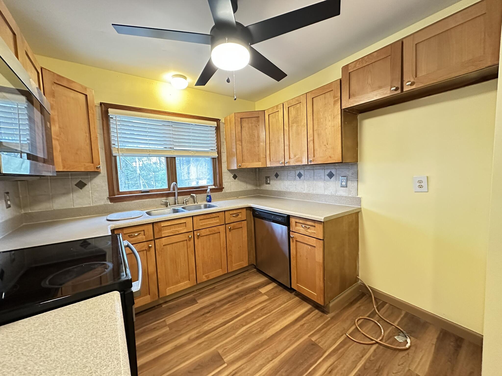 227 Image Drive Scotrun, PA 18355 - Photo 9 of 39 a kitchen with stainless steel appliances granite countertop a sink a stove cabinets counter space and a window