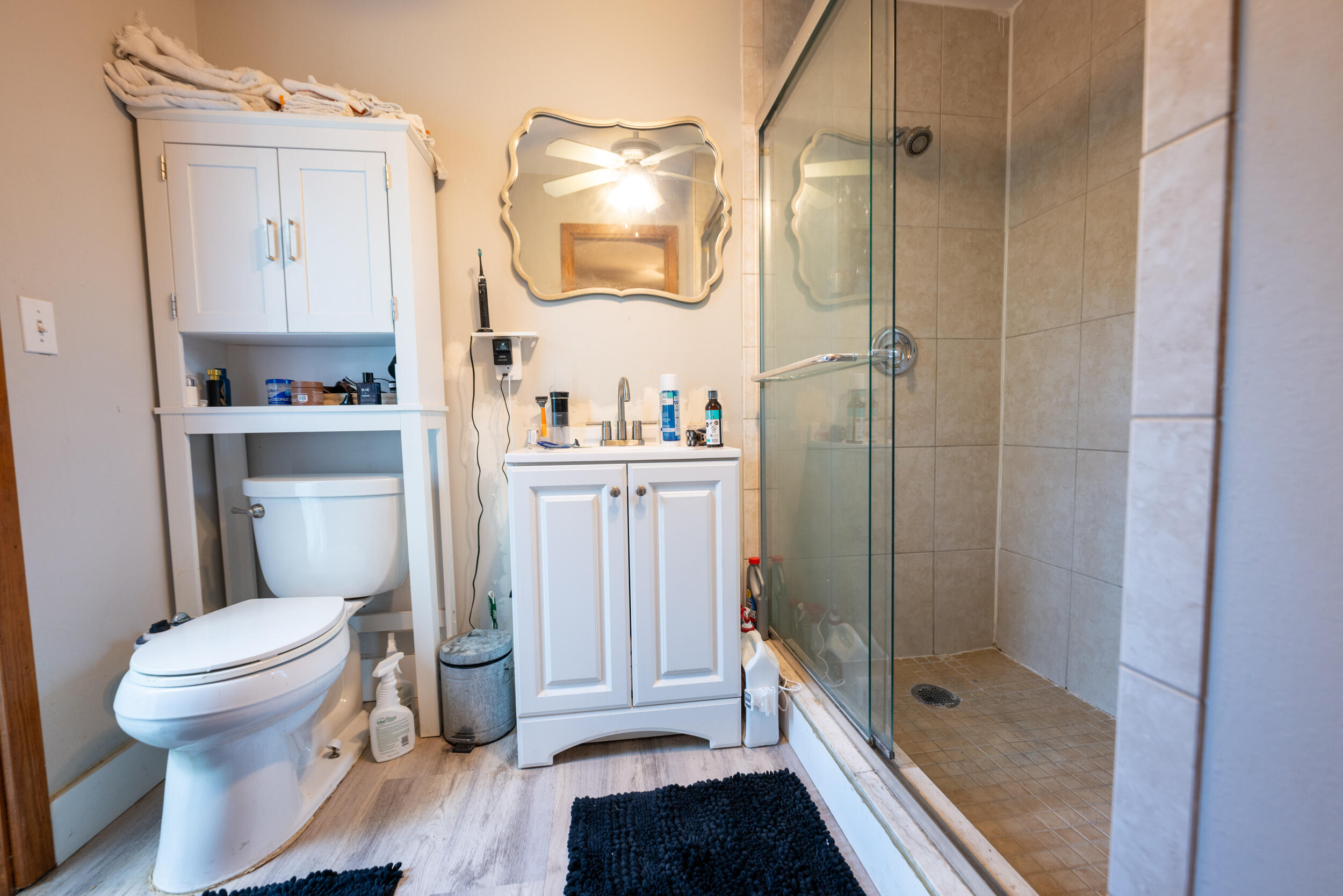 3001 Riviera Drive Key West, FL 33040 - Photo 8 of 17 a bathroom with a granite countertop shower a toilet and a sink