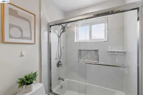 a view of a bedroom and bathroom