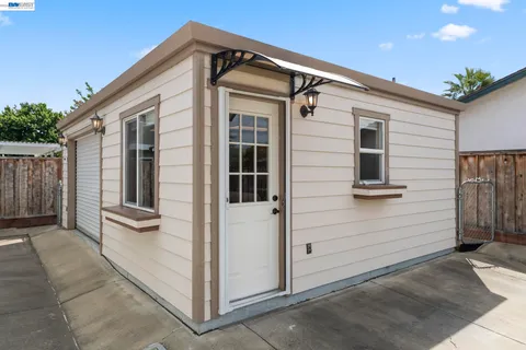 a view of a back yard from a hallway