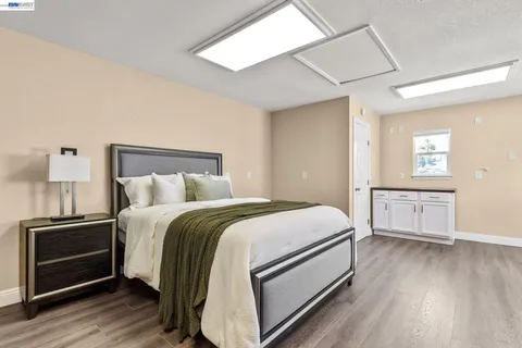 a bedroom with a bed and a couch