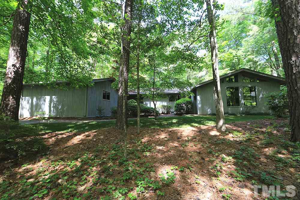 2700 Conover Court Raleigh, NC 27612 - Photo 1 of 30 a backyard of a house with lots of green space