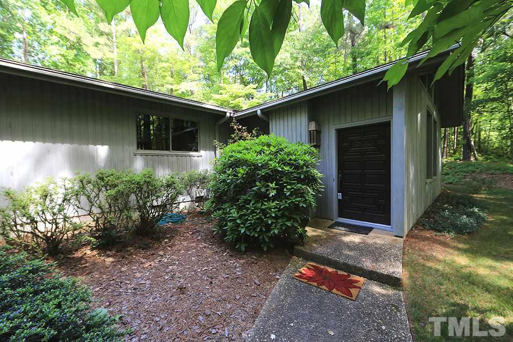 2700 Conover Court Raleigh, NC 27612 - Photo 2 of 30 a backyard of a house with plants and garden