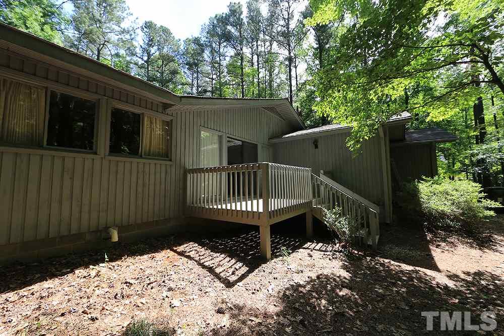 2700 Conover Court Raleigh, NC 27612 - Photo 30 of 30 a view of balcony with wooden fence and trees