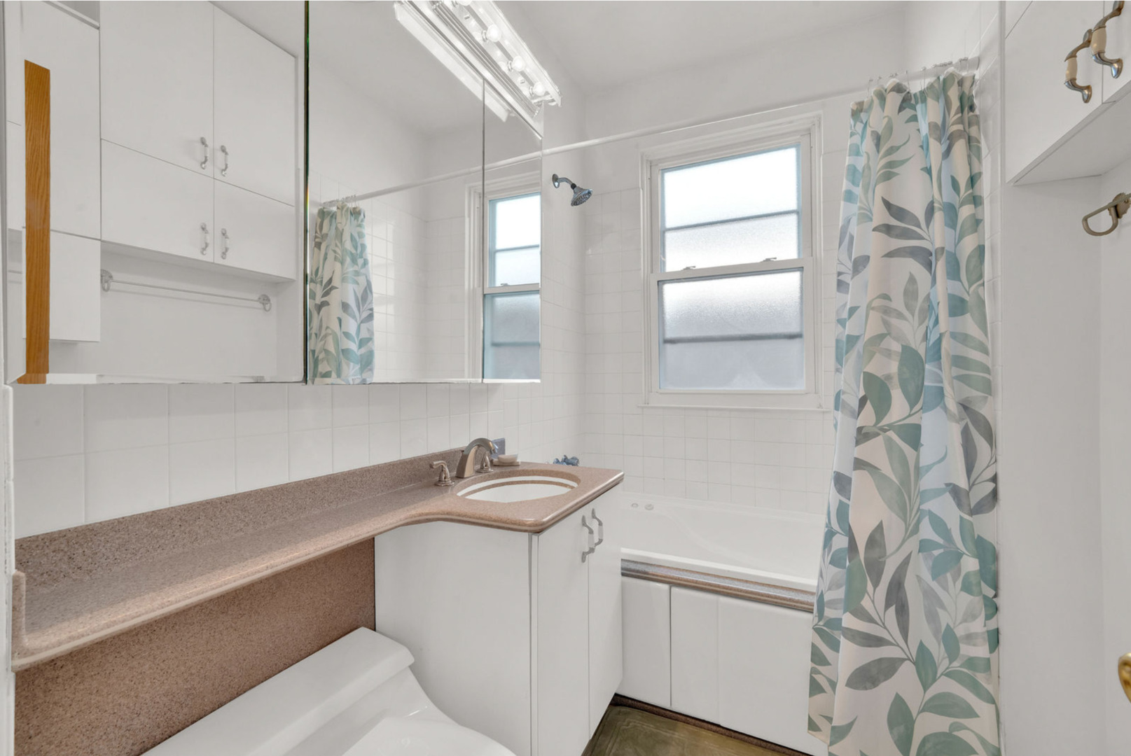 6238 South Massasoit Avenue, Unit 1 Chicago, IL 60638 - Photo 11 of 17 a bathroom with a sink toilet and shower