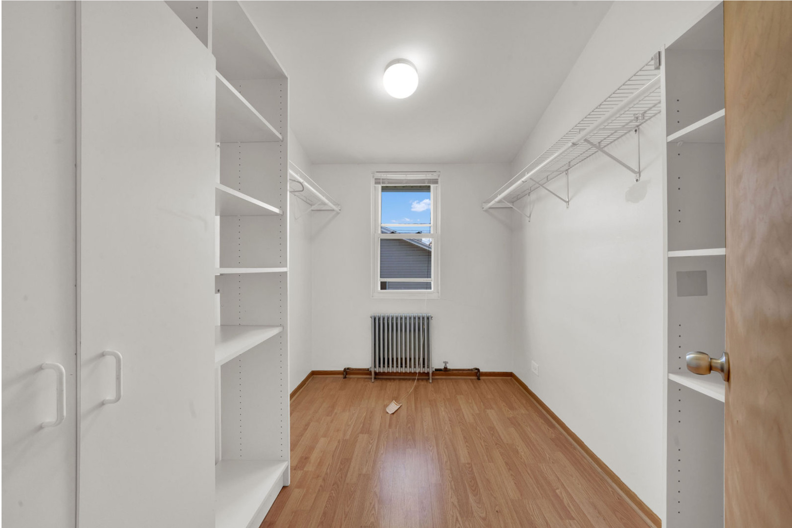 6238 South Massasoit Avenue, Unit 1 Chicago, IL 60638 - Photo 14 of 17 a view of empty room with wooden floor and fan