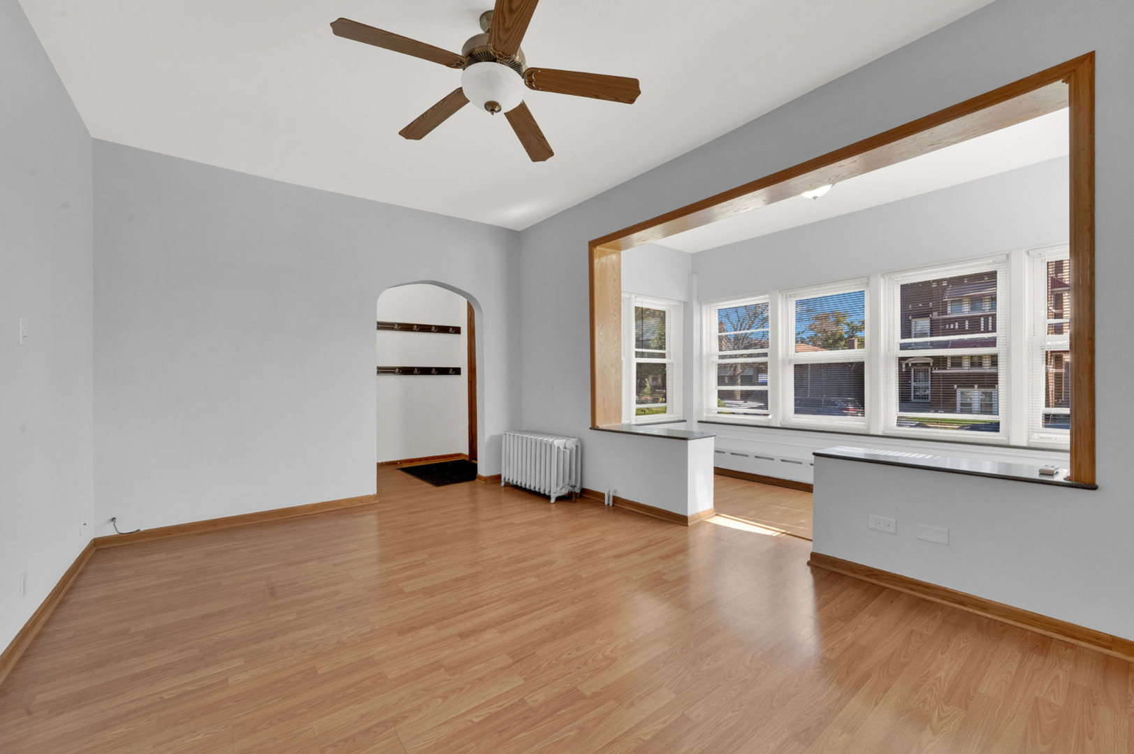 6238 South Massasoit Avenue, Unit 1 Chicago, IL 60638 - Photo 3 of 17 wooden floor in an empty room with a window