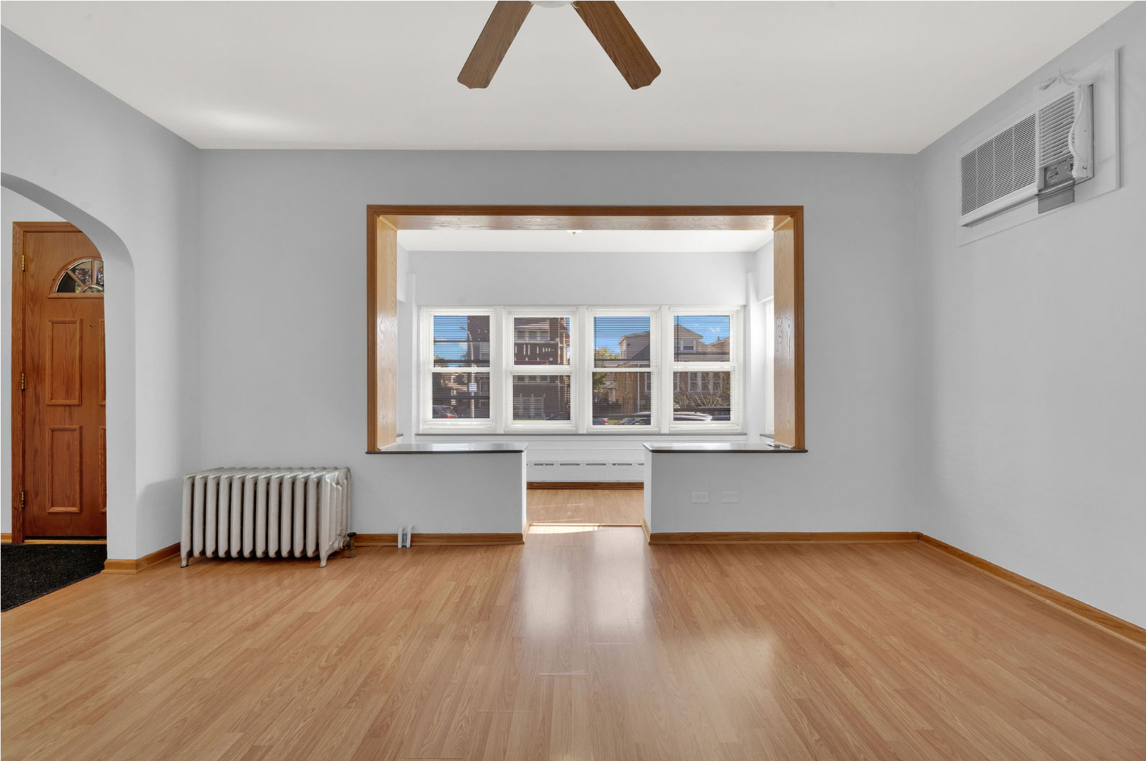 6238 South Massasoit Avenue, Unit 1 Chicago, IL 60638 - Photo 4 of 17 a view of an empty room with wooden floor and a window