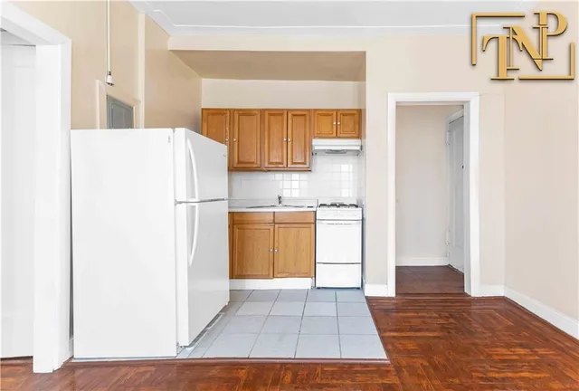 a spacious bedroom with a bed and a large window