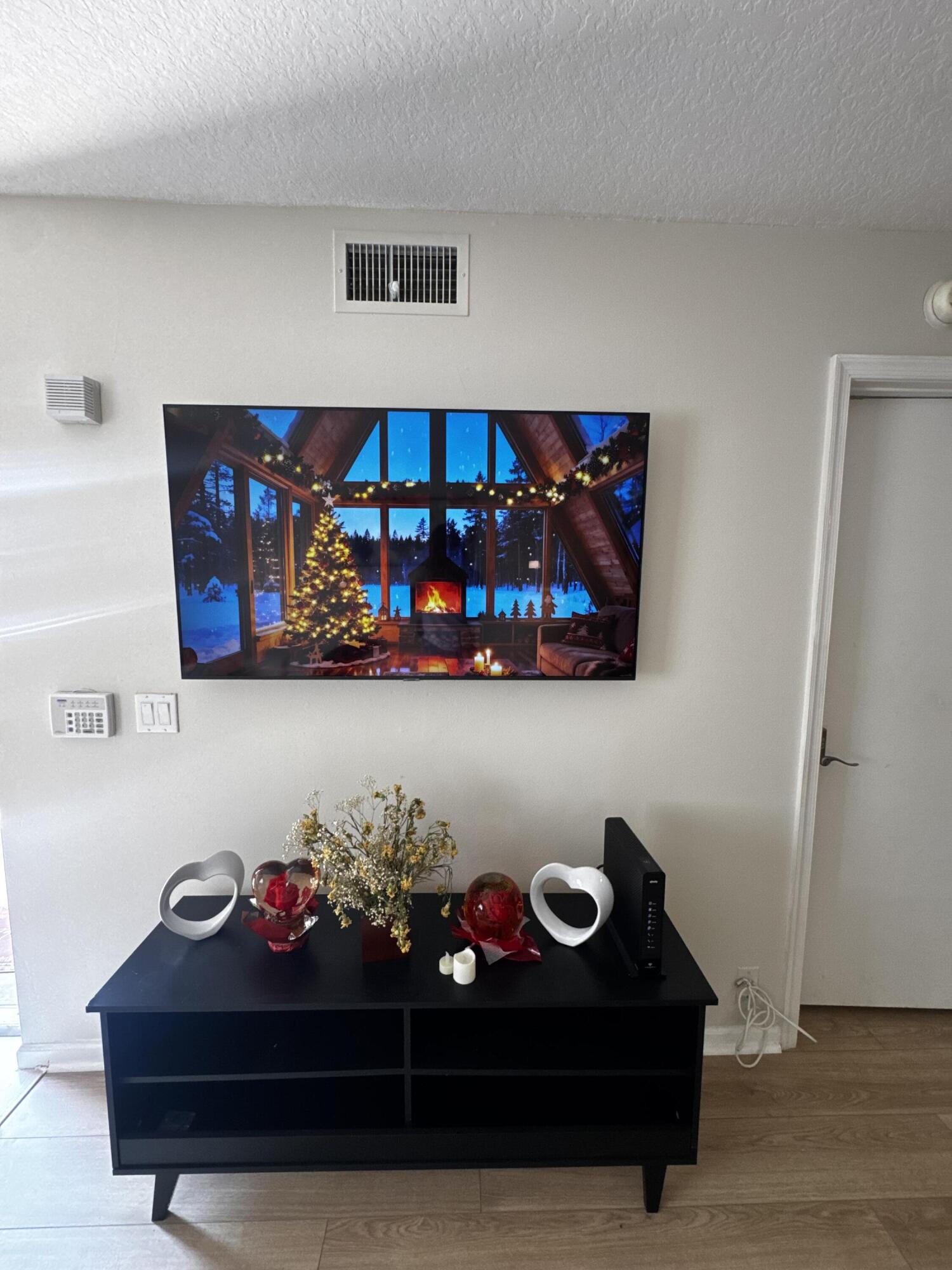 3810 North Jog Road, Unit 105 Royal Palm Beach, FL 33411 - Photo 6 of 26 a front view of a house with lots of flowers