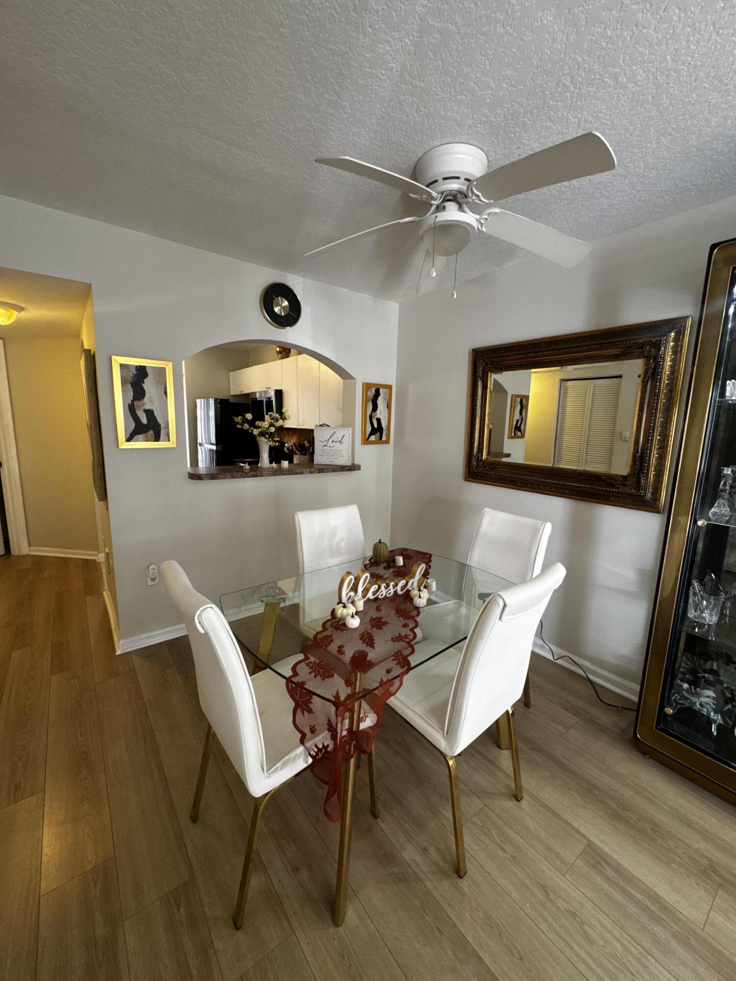 3810 North Jog Road, Unit 105 Royal Palm Beach, FL 33411 - Photo 8 of 26 a dining room with furniture and window