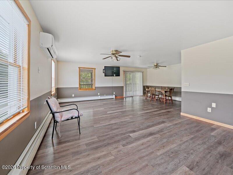 9-17 Vago Road Tunkhannock, PA 18657 - Photo 12 of 57 a living room with furniture and a wooden floor