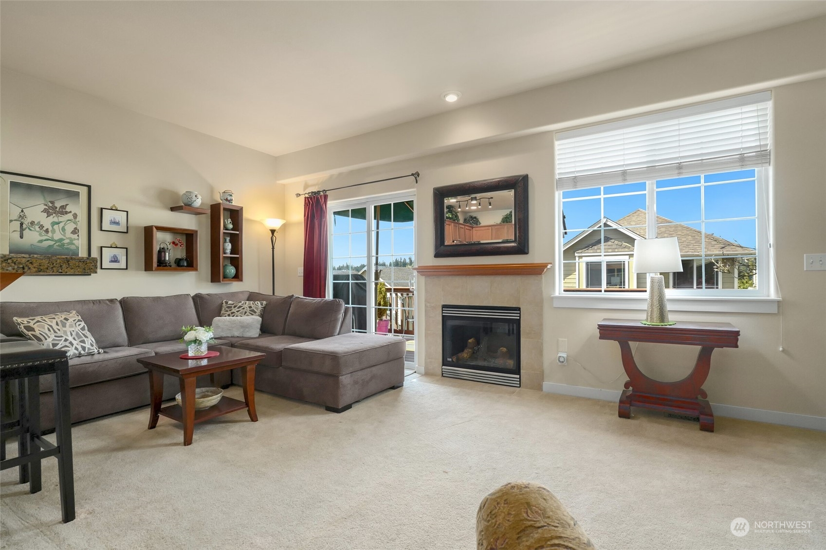 24062 40th Avenue Southeast, Unit 16 Bothell, WA 98021 - Photo 8 of 19 a living room with furniture and a fireplace